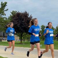 Participants turning corner waving